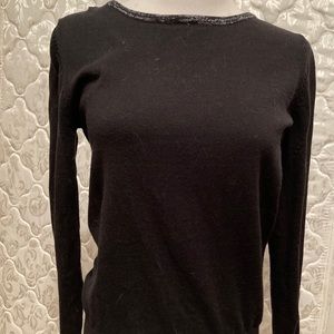 Black sweater with silver glitter bows down back